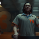 Tom Hiddleston appears on trial in a beige jumpsuit as Loki in Marvel Studio's newest Disney+ streaming series.